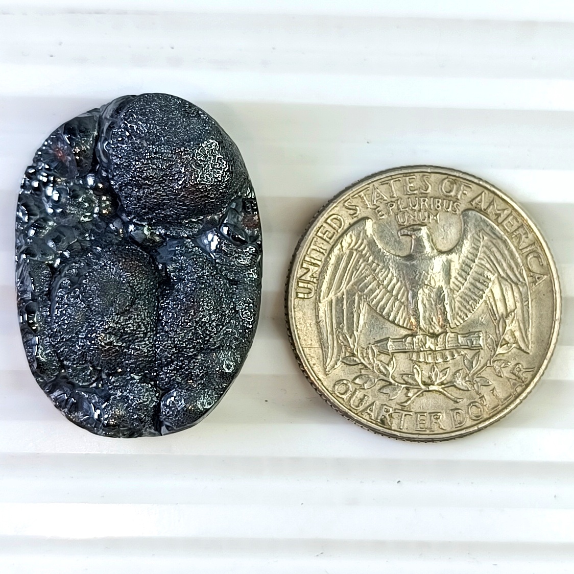 Botryoidal Hematite 29×21mm polished cabochon with metallic luster and natural bubble-like surface.