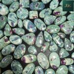 Natural Ruby Fuchsite cabochons with polished dome tops and flat backs for easy setting. Wholesale lots available, perfect for jewelers, artisans, and crystal lovers.